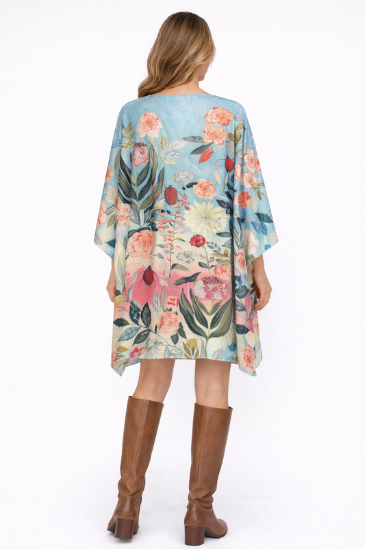 A lightweight Merino wool kaftan featuring a soft floral digital print and an easy, elegant drape.